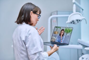 doctor-dentist-working-in-office-using-laptop-ma-2024-12-08-01-49-06-utc